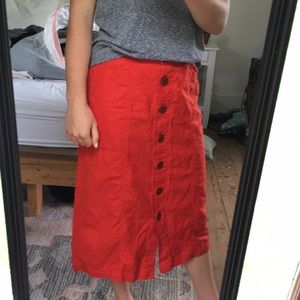 Cute red midi skirt with buttons universal thread.